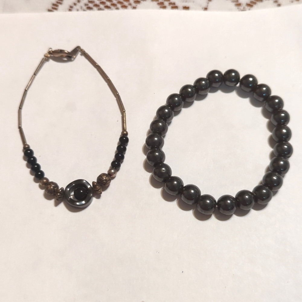 2 bracelets black beaded one is magnetic